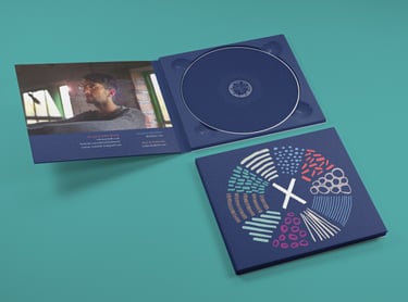 A CD case opened up showing the inside design over a green background.