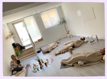 Martina guiding yoga students during a yoga nidra visualisation meditation in Lisbon, Portugal.