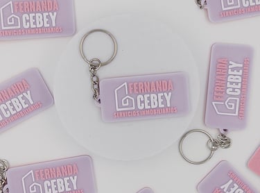 3d llaveros inmobiliaria Fernanda Cebey on a white background.