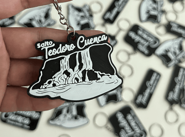 Custom black and white rubber 3d llavero the Salto Teodoro Cuenca waterfall design.