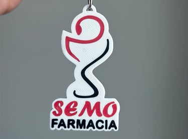 Custom 3D printed SEMO Farmacia llavero santo tomefeaturing a red and black bowl of Hygieia logo.