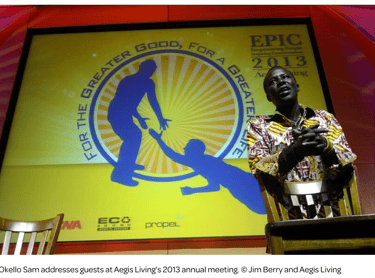 Okello Sam addresses guests at Aegis Living's 2013 annual meeting. © Jim Berry and Aegis Living