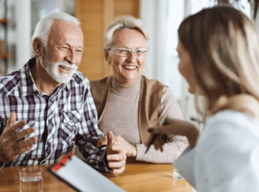 an older couple talking to their doctor