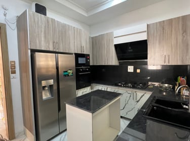 Fully equipped kitchens with refrigerators, microwaves, ovens, and stovetops