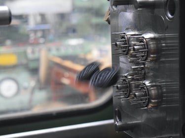 interior of a mold for injection molding ejecting the completed parts