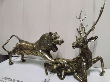 "Handcrafted brass sculpture of a lion hunting a deer-Qualified for export"
