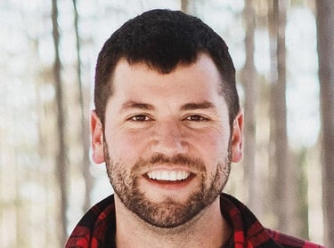 A man smiling outdoors