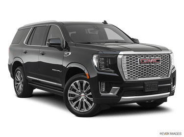 Stylish GMC Yukon XL Denali showcased against the urban backdrop of downtown Columbus, Ohio, embodyi