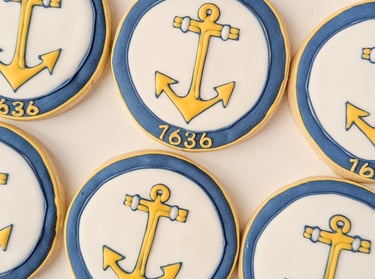 RI Secretary of State anchor logo on a cookie in yellow, white, and blue
