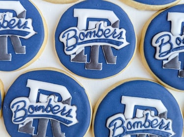 Cookies with CLCF Bombers logo in blue, gray, and white