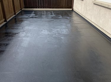 Construction tools and materials neatly stacked at a building site.