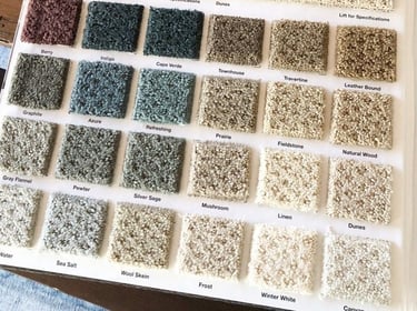 a book opened to show a selection of carpeting