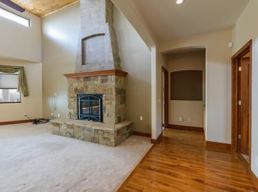 a fireplace in a large room
