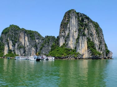 a group of boats floating on top of a body of water