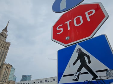 a stop sign with a pedestrian crossing sign