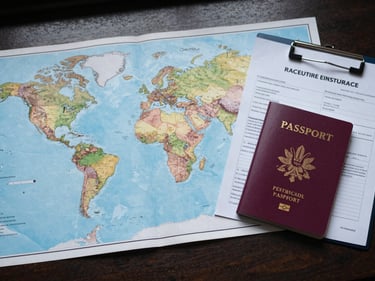 Flat lay of a world map spread open on a desk, a passport and a neatly clipped set of international insurance documents beside it, cool natural overhead light, no people