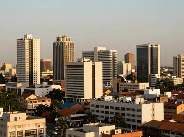 Expansive view of Accra's modern city center, architectural buildings, warm sunlight, clean composition.