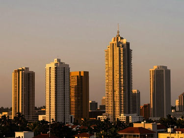 Wide-angle shot of the Lagos skyline at dusk, modern skyscrapers, golden hour light, rich saturated tones.