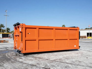 Wide-angle shot of a clean 30-yard orange roll-off dumpster on an active, organized commercial construction site in Orlando, bright daylight