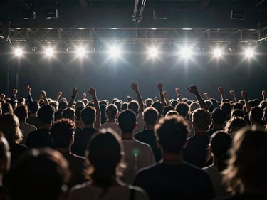 Cinematic shot of a high-energy event, dynamic lighting, crowd in motion, 16:9 aspect ratio, moody backlighting, anamorphic lens flares