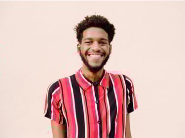 a man with a beard and a striped shirt