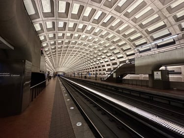 A Washington metro subway station, featuring a concrete grid pattern on the ceiling