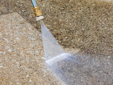Pressure washing restoring a patio surface