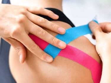 Physiotherapist apply tapping on shoulder jiont to reduced inflammation and pain.