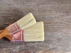 brown wooden handle painting brush on brown wooden table