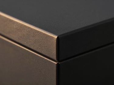 Close-up of a luxurious dark grey rigid box, smooth texture, sharp corners, low-key moody lighting, warm gold highlights, 35mm lens, structural integrity.