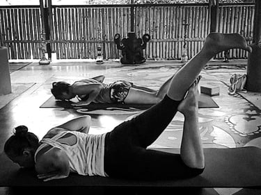 Yoga students practicing a yoga pose.