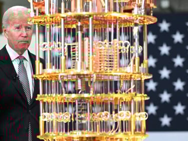 a man in a suit and tie is standing in front of a large model of