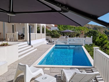View from the west sun terrace of the pool, apartment balcony and the east sun terrace.
