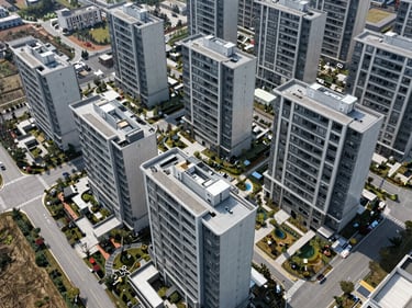 High-altitude overhead drone shot of a structured real estate development site with clean geometric lines.