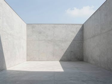 Symmetrical architectural photography of a minimalist interior space with clean concrete walls and natural light.