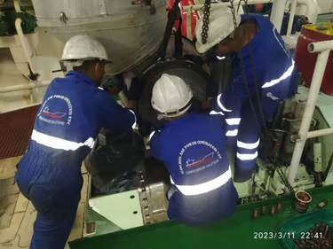 our service team on board the ship engine fixing turbocharger