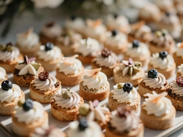 Close-up of delicately arranged canapés on a serving tray at a cocktail event, bright natural daylight, warm desaturated earth tones, elegant styling, shallow depth of field, 35mm