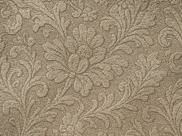 Macro flat-overhead close-up of jacquard specialty woven fabric under cool studio strobe, intricate pattern structure visible in fiber relief, neutral champagne tone, no garments