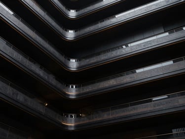 Abstract representation of brand identity architecture, sleek lines, and subtle gold accents, dramatic low-key lighting, premium editorial photography, deep obsidian and metallic tones, cinematic wide-angle, highly detailed, 35mm