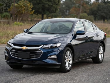 2019 Chevrolet Malibu, navy blue, parked on asphalt in natural flat outdoor light, three-quarter front view, journalism style