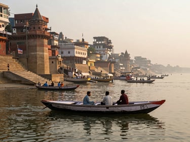 An uncrowded view of the ancient ghats of Varanasi from a private boat on the Ganges, soft sunrise light, atmospheric mist