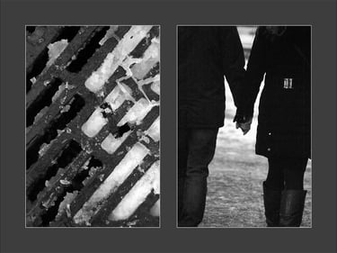 two people holding hands while walking down a street