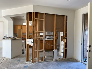 Kitchen wall removal and drywall repair project in Sun City West, AZ by At Hand Heroes.