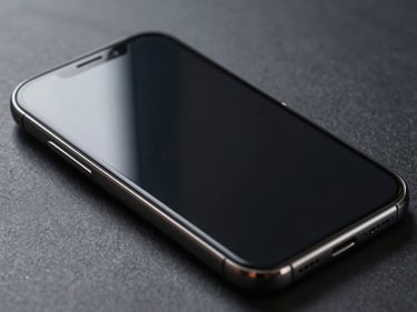 Close-up straight-on shot of a smartphone face-up on black seamless, screen fully intact after a drop-test, side-lighting reveals the protective film layer with no cracks, forensic detail