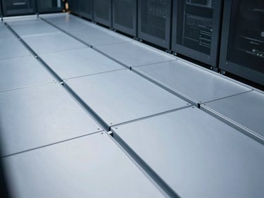 Clean close-up of a modern raised access flooring system in a server room, showing modular panels and sub-floor integration, crisp cool-toned architectural lighting.