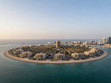 Elevated wide-angle view of Palm Jumeirah frond villa plot, low horizon, turquoise water on both sides, late afternoon architectural light, no people