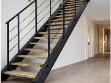 Escalera metálica con barandilla fabricada en Vigo