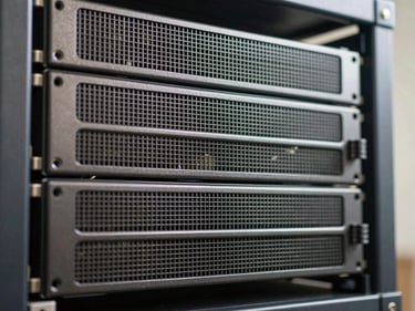 Close-up of stacked enterprise server units in a rack, bright studio lighting, sharp metal chassis detail, no text or branding visible