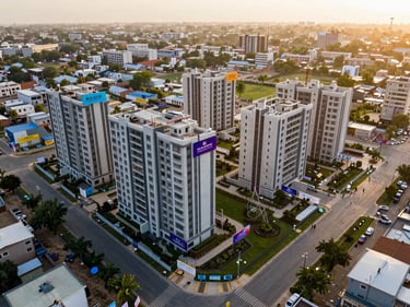 Aerial wide shot of a newly launched residential project site in Mohali Sector 105, construction hoardings visible, premium landscaping planned around the perimeter, golden afternoon light, shot from directly above at moderate altitude