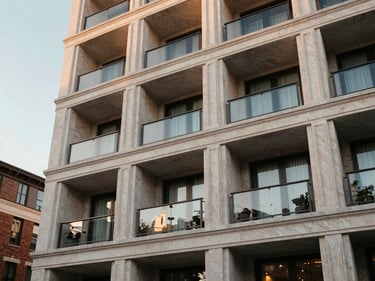 Bristol at Parkway Place, luxury condominium exterior, elegant architectural details, warm evening light, sophisticated urban setting, warm editorial photography